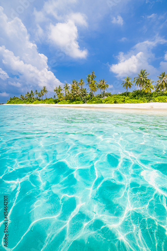 Beautiful tropical beach with white sand, palm trees, turquoise ocean blue sky clouds on sunny summer. Majestic panoramic landscape background for relaxing vacation, island of Maldives. Amazing nature