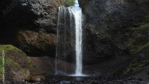 Moul Falls, a waterfall pours into a pool below in a small canyon photo