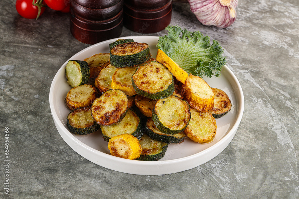 Roasted young zucchini in the plate Roasted young zucchini in the plate