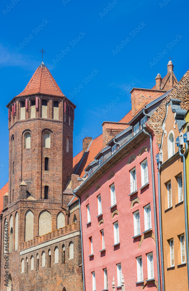 Tower of the Mikolaja church and colorful houses in Gdansk, Poland