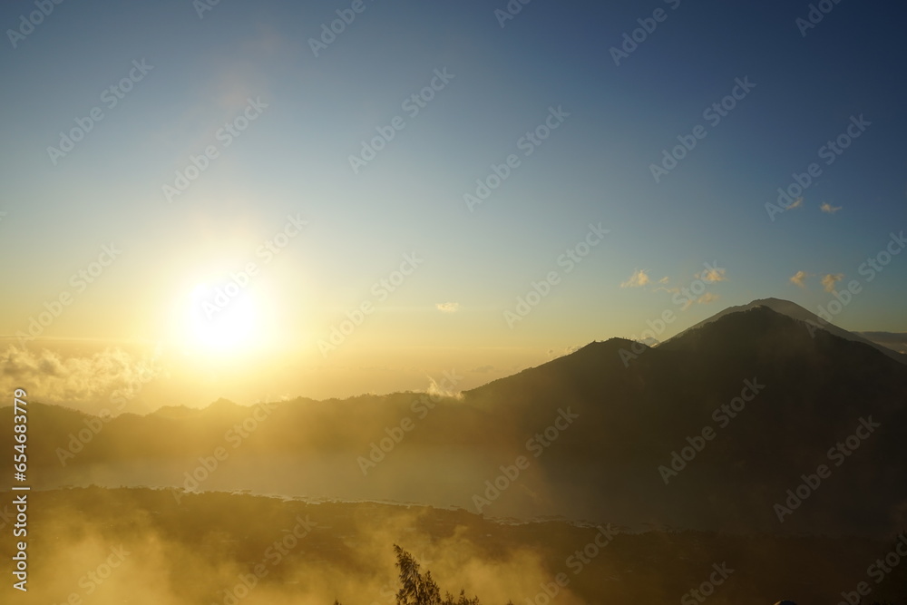 Naklejka premium sunrise on mount batur indonesia volcano, vulcanic sunrise