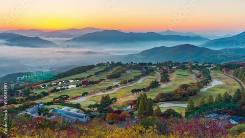 Time lapse Beautiful green nature and mist foggy flows around the mountains in the morning with mild sunshine.Autumn season at Baekbongsan mountain in Namyangju-si, Gyeonggi-do, South