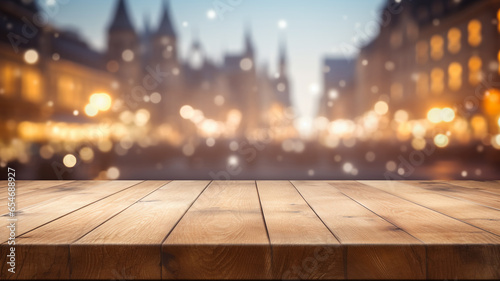 Empty rustic wooden table with european architecture city old classic  building  blurred bokeh lights background romantic atmosphere.