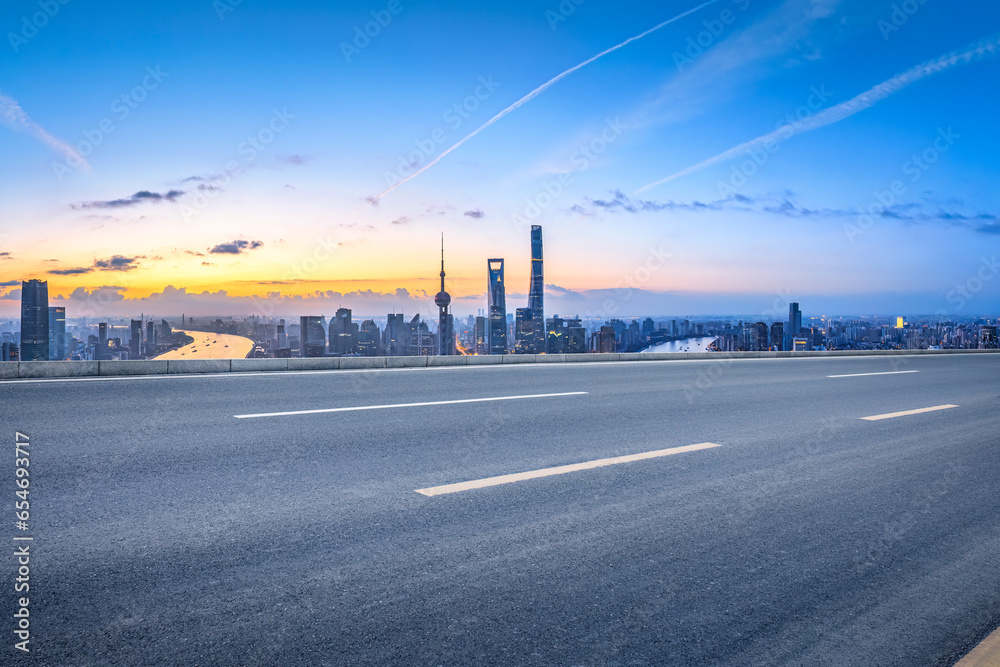 Shanghai city skyline and asphalt road in the morning