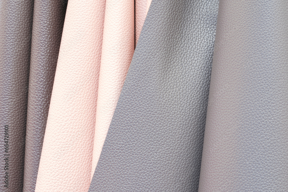 Mix colorful hanging vertical stripe leather on the rack. Texture of multicolored leather close up. Mix colorful hanging vertical stripe leather on the rack. Texture of multicolored leather close up.