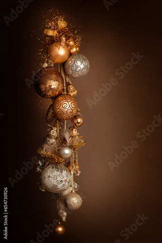 Wallpaper Mural A bunch of New Year's Christmas balls of white gold yellow color on a dark background. Balls hang on a ribbon with a garland. Torontodigital.ca