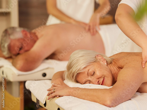 Relax, back massage and senior couple at a spa for luxury, self care and muscle healing treatment. Health, wellness and elderly man and woman on a retirement retreat for body therapy at natural salon