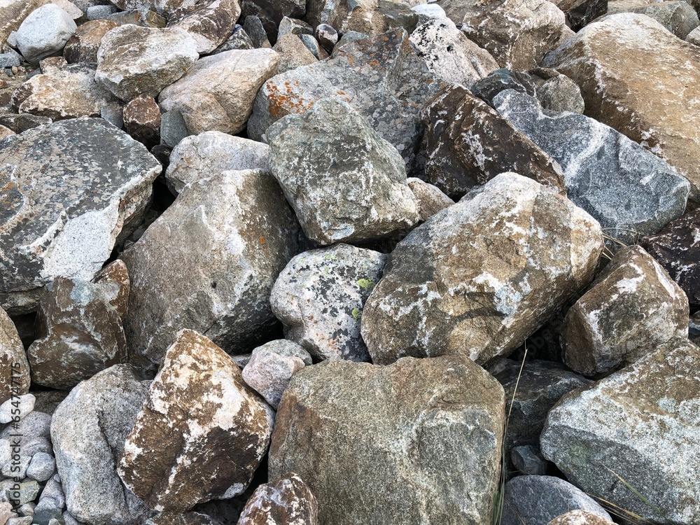 A close up big light gray stone texture for background, a stone background or a gravel stone wall texture pattern 