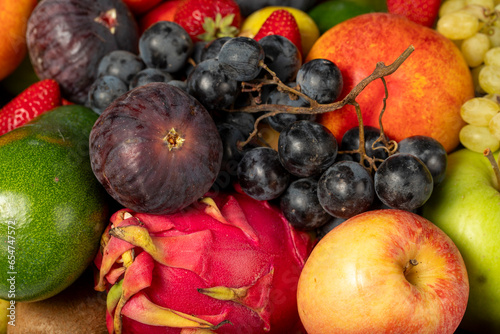 Group of fresh fruits organics for healthy. Colorful fruits. Grape  Fig  Strawberry  apple  pear  kiwi  peach