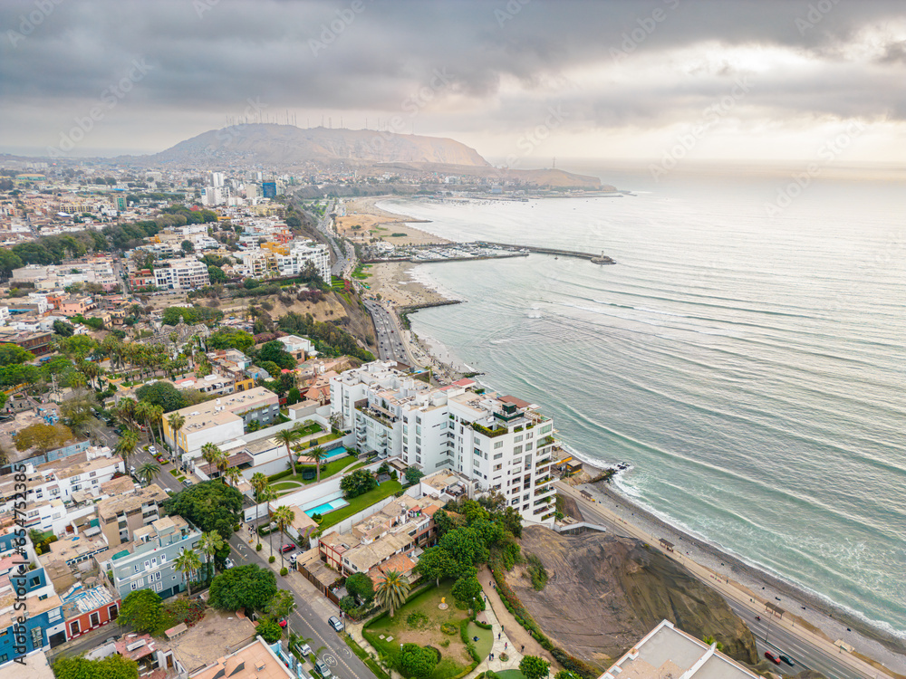 Fototapeta premium Aerial view of the Barranco neighborhood in Lima, Peru in 2023. Spanish colonial style historic buildings. Neighborhood with new houses and also many houses degraded by time. Gastronomic region