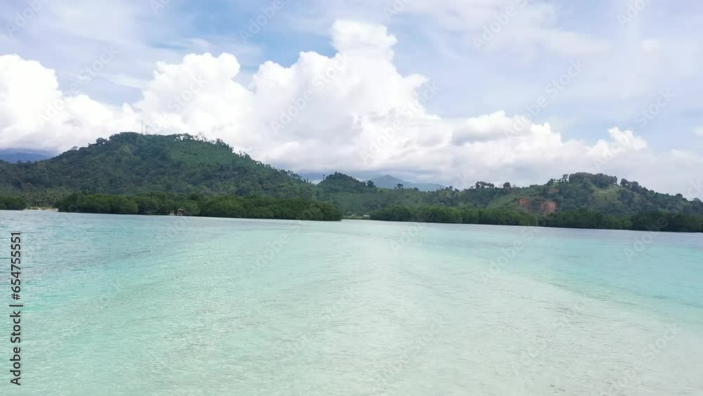 Dron's camera moved quickly towards an island in the middle of the sea. Dron's camera moved quickly towards an island in the middle of the sea.