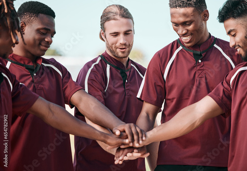 Sports, support and teamwork on field, huddle with hands and solidarity in college competition. Smile, men and team building in rugby, friends at training with motivation, hope or happy game together