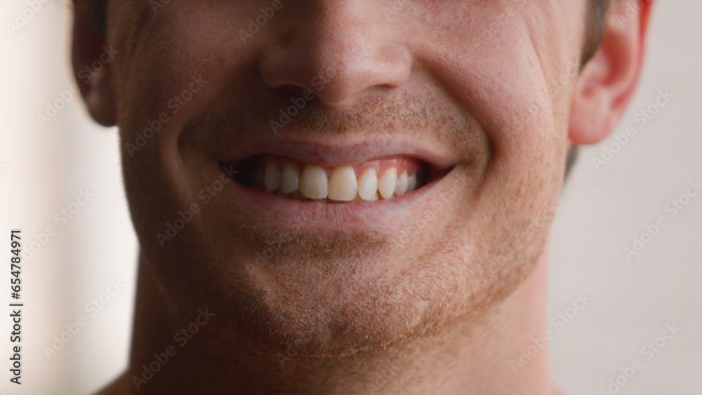 Fototapeta premium Cropped view unrecognizable Caucasian man smile toothy male teeth smiling happy joyful carefree cheerful guy home medical clinic orthodontic oral dentistry hygiene dental health whitening procedure