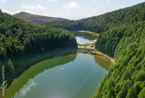Aerial view of Lake of Empadadas (Lagoa das Empadadas) surrounded by cryptomeria trees. Sete Cidades Sao Miguel island in the Azores.