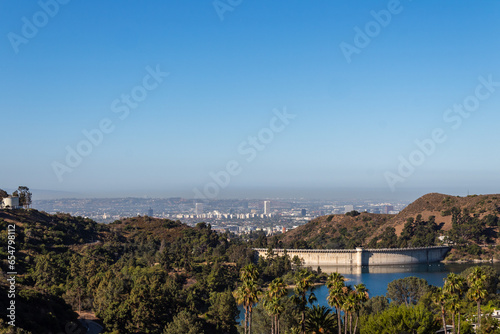 Hollywood Reservoir behind Mulholland Dam, in the Hollywood Hills, situated in the Santa Monica Mountains and north of the Hollywood neighborhood of Los Angeles, California.
