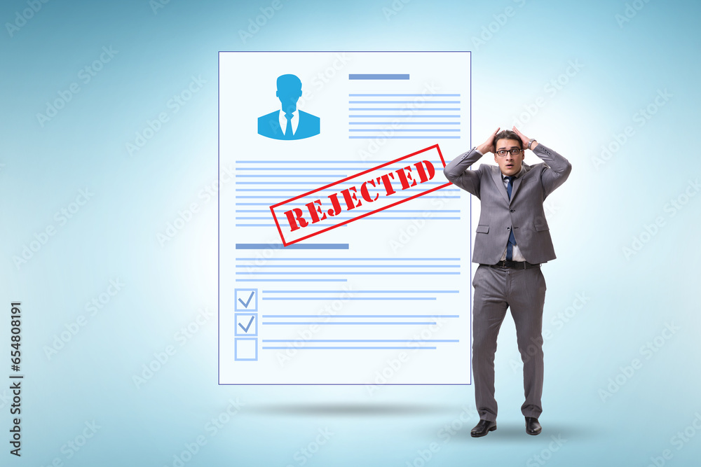 Man receiving rejection notice on his cv Man receiving rejection notice on his cv