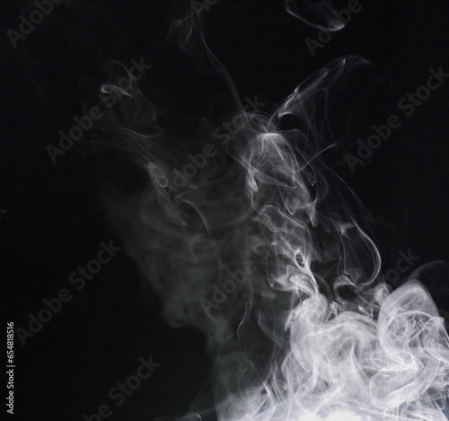 Smoke, fog or gas in a studio with dark background by mockup space for magic effect with abstract. Incense, steam or vapor mist moving in air for cloud smog pattern by black backdrop with mock up.