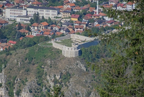 Sarajevo, Bosnia and Herzegovina - Sep 28, 2023: Distant view of Sarajevo city in Bosnia and Herzegovina federation from the surrounding viewpoints in a sunny summer afternoon. Selective focus. photo