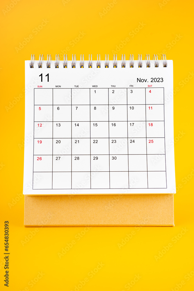 The November 2023, Monthly desk calendar for 2023 year on yellow color background. The November 2023, Monthly desk calendar for 2023 year on yellow color background.