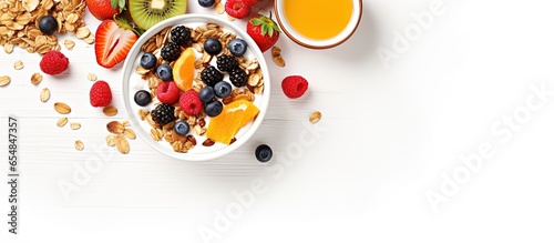 Granola breakfast bowl with fruits nuts and milk on white background with copyspace for text