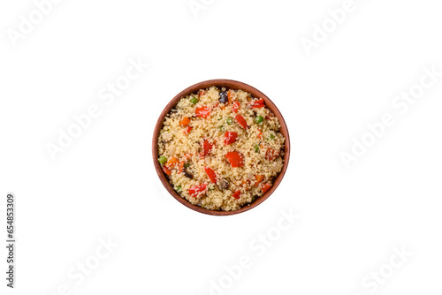 Delicious couscous porridge with cubes of grilled vegetables with salt and spices