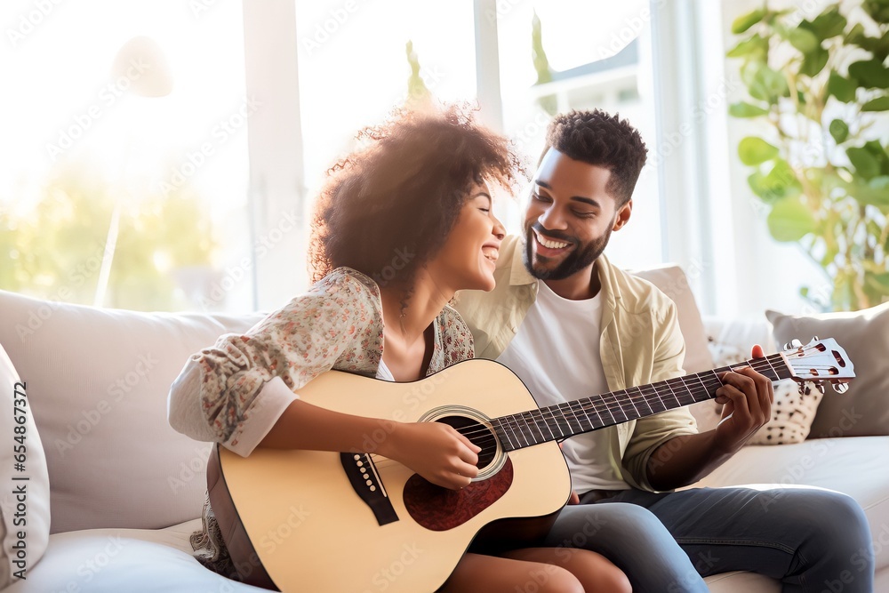 young african american couple playing guitar at home white modern home - obrazy, fototapety, plakaty 