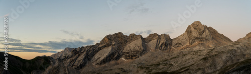panoramic view of Plattspitzen and Gatterlkopf mountains during sunrise in golden light