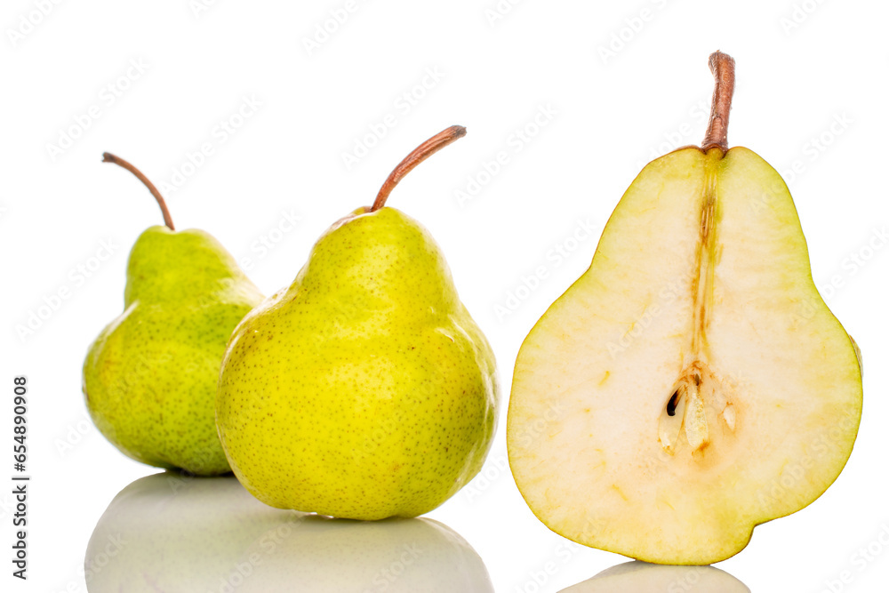 One half of a ripe pear and two whole pears, macro, isolated on white background. One half of a ripe pear and two whole pears, macro, isolated on white background.