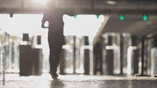 People walk at the exit of the train station
