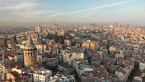 Wallpaper Mural A drone approaches the Galata Tower in Istanbul Beyoglu district at sunset. There are many residences around the tower. Beyoglu, Turkey. Torontodigital.ca