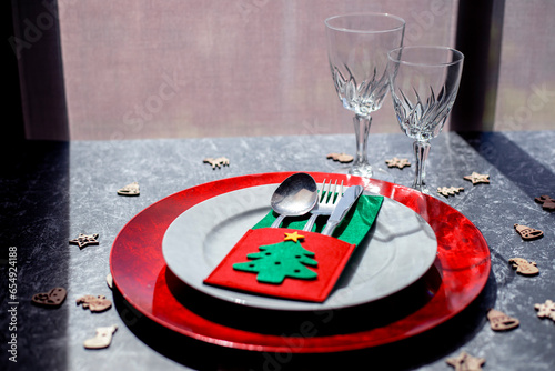 Nice Christmas table setting on black and white background, top view