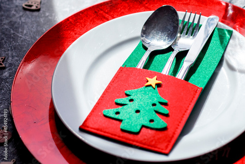 Nice Christmas table setting on black and white background, top view