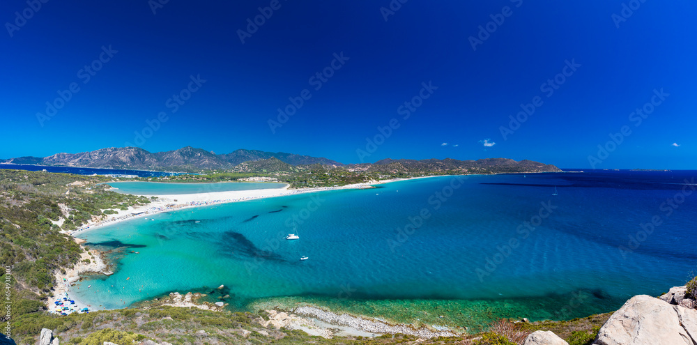 Aerial view of Porto Giunco beach and tower in Villasimius, Sardinia, Italy