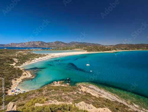 Aerial view of Porto Giunco beach and tower in Villasimius, Sardinia, Italy
