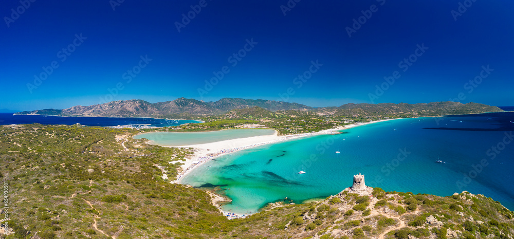 Aerial view of Porto Giunco beach and tower in Villasimius, Sardinia, Italy