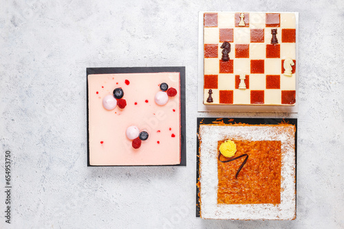 Assortment of various fresh colorful cakes.