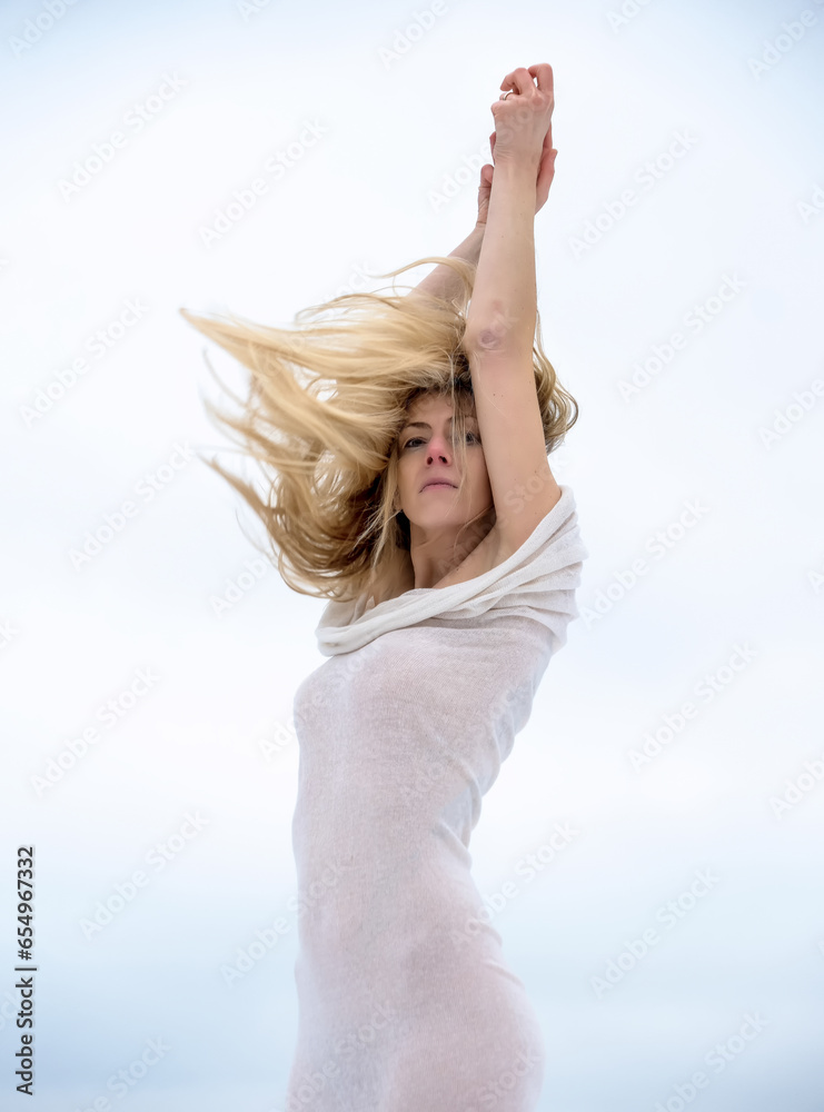 sexy elegant adult blonde woman, her body wrapped in long skin tight white dress, highlighting body shapes, as living statue, as germanic goddess valkyrie with blowing hair, work of art sexy elegant adult blonde woman, her body wrapped in long skin tight white dress, highlighting body shapes, as living statue, as germanic goddess valkyrie with blowing hair, work of art