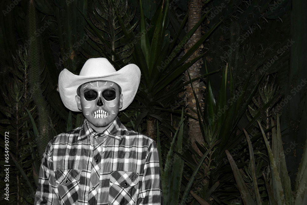 Man with hat and sugar skull makeup during Day of the Dead celebration in Mexico - Dia de muertos Man with hat and sugar skull makeup during Day of the Dead celebration in Mexico - Dia de muertos