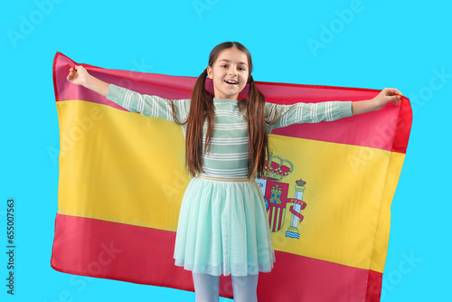 Little girl with flag of Sp...