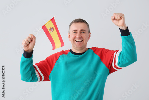 Happy mature man with flag ...