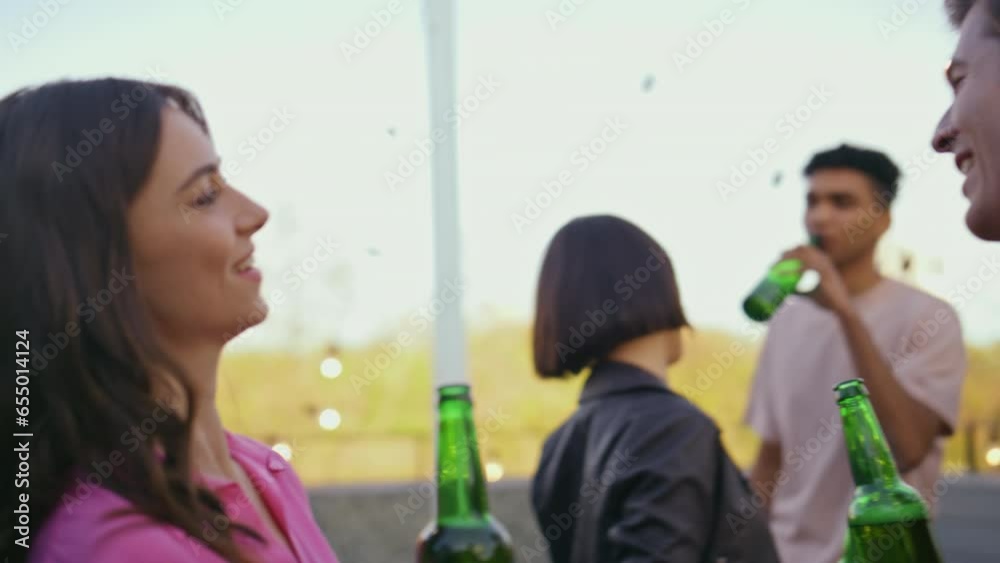 Partying couple talking terrace place close up. Relaxed man woman drinking beer Partying couple talking terrace place close up. Relaxed man woman drinking beer
