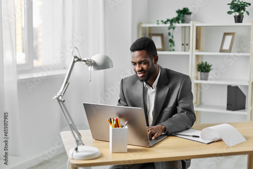american man computer job laptop office entrepreneur education student african online freelancer