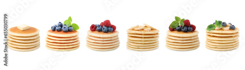 Set of tasty pancakes with toppings isolated on white
