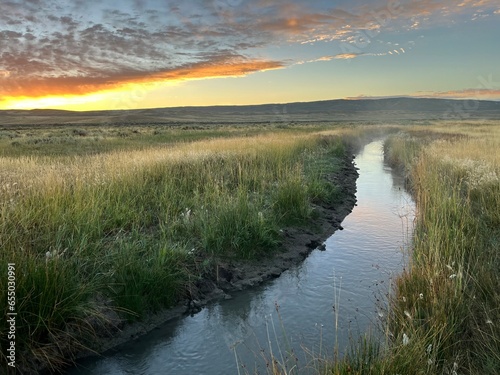 Sunrise over a stream in the grasslands of eastern Wyoming