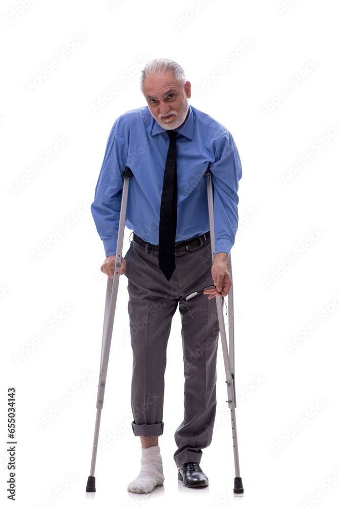 Old businessman with crutches isolated on white Old businessman with crutches isolated on white
