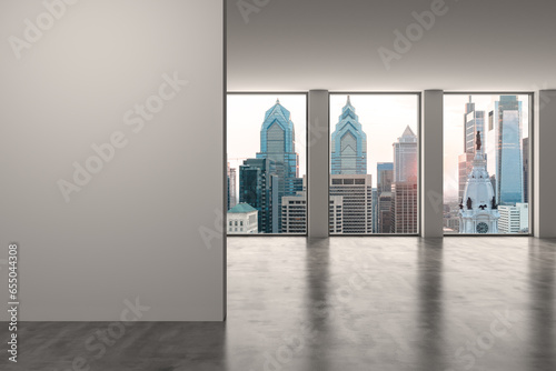 Downtown Philadelphia City Skyline Buildings from High Rise Window. Beautiful Expensive Real Estate overlooking. Empty room Interior. Mockup wall. Skyscrapers Cityscape. Sunset. Penn. 3d rendering.
