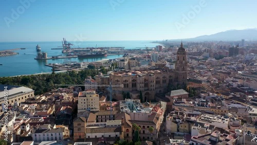 Aerial 4K video from drone to Alcazaba and Castle of Gibralfaro in the background a panoramic view of the city of Malaga and old town Malaga at sunset. Malaga,Costa del sol, Andalusia,Spain, (Series)