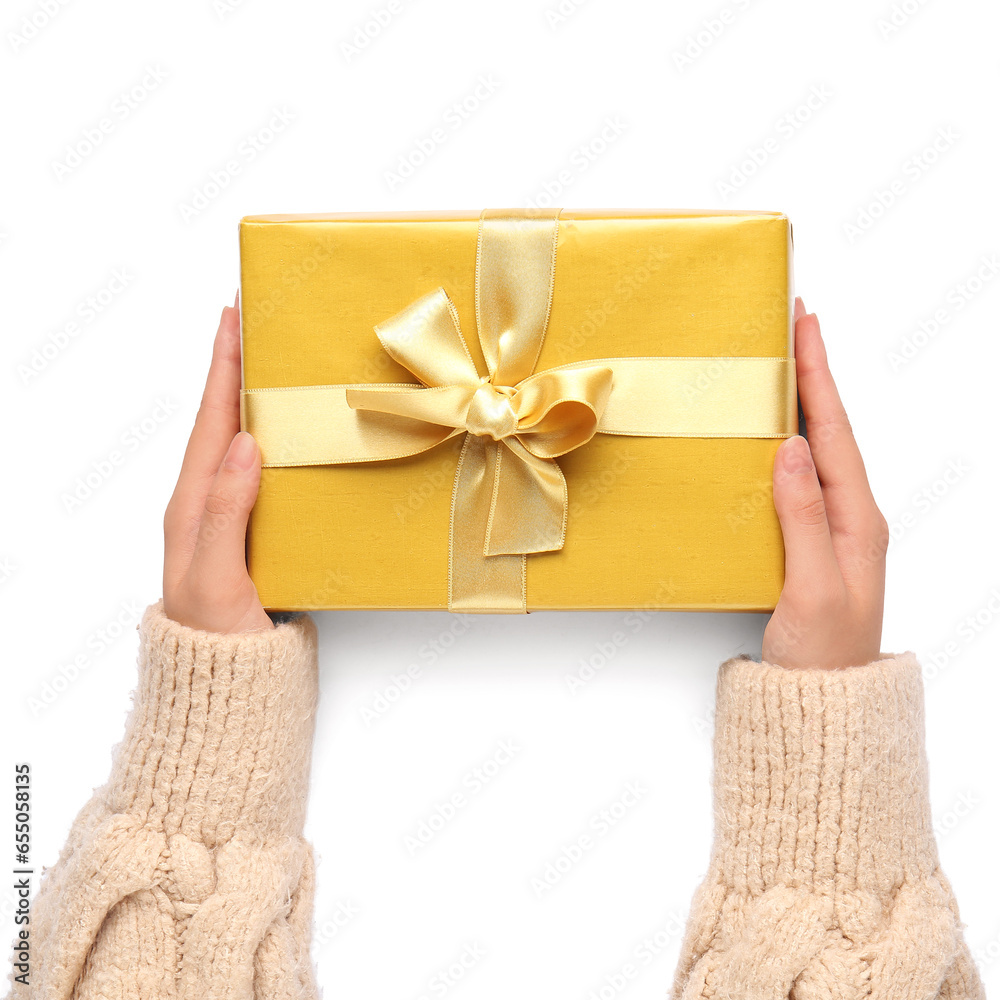 Female hands with bright Christmas gift on white background, closeup Female hands with bright Christmas gift on white background, closeup