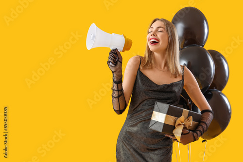 Young woman with gift shout...