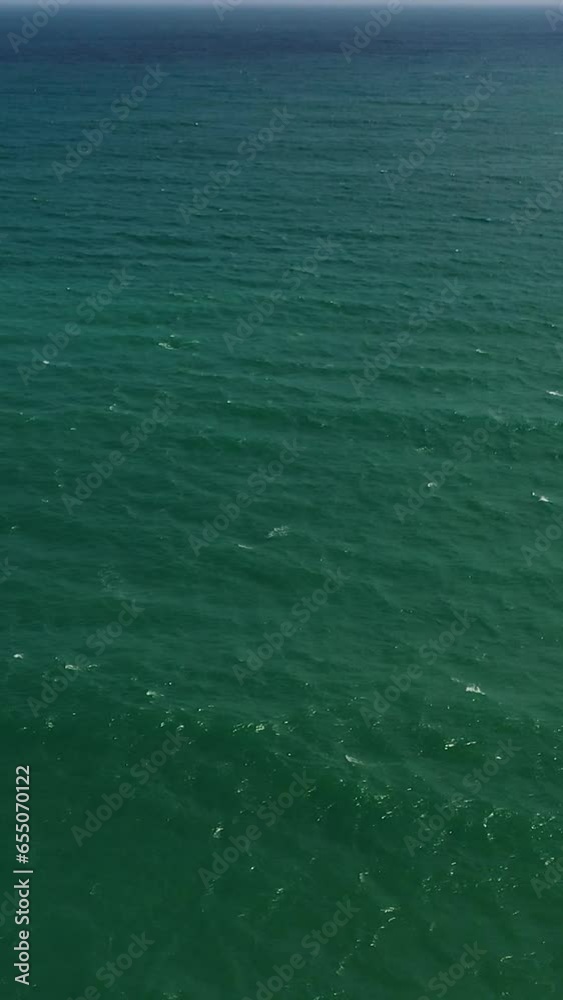 Aerial view of Blue sky with clouds over sea. Flight over the sea. Summer and travel vacation concept.